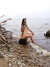 A lovely older woman is posing nude