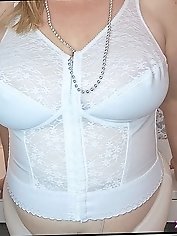 Hot mature brunette shows off her pantyhose clad pussy by lifting her skirt